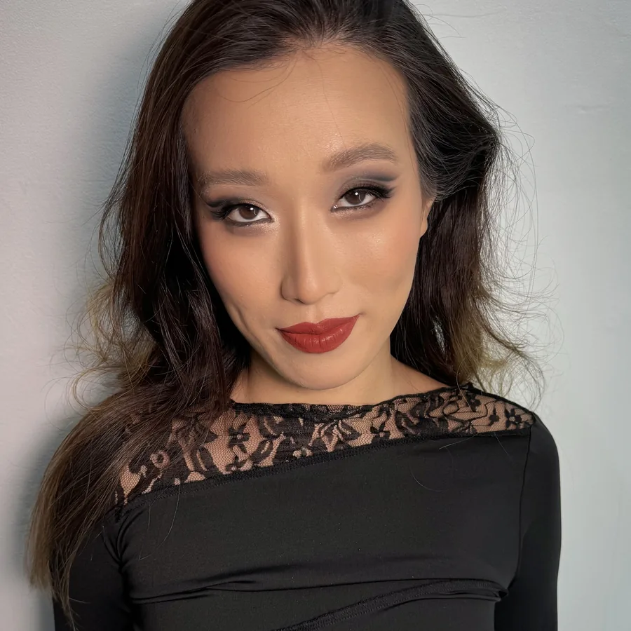 Smoky eye and a deep red lip for an evening event, worn with black lace
