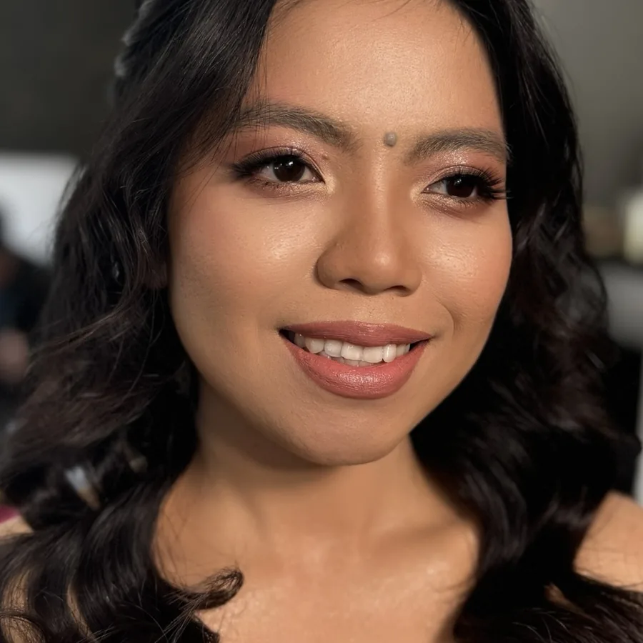 Makeup for Asian features kept soft and natural, loose waves and a glossy lip
