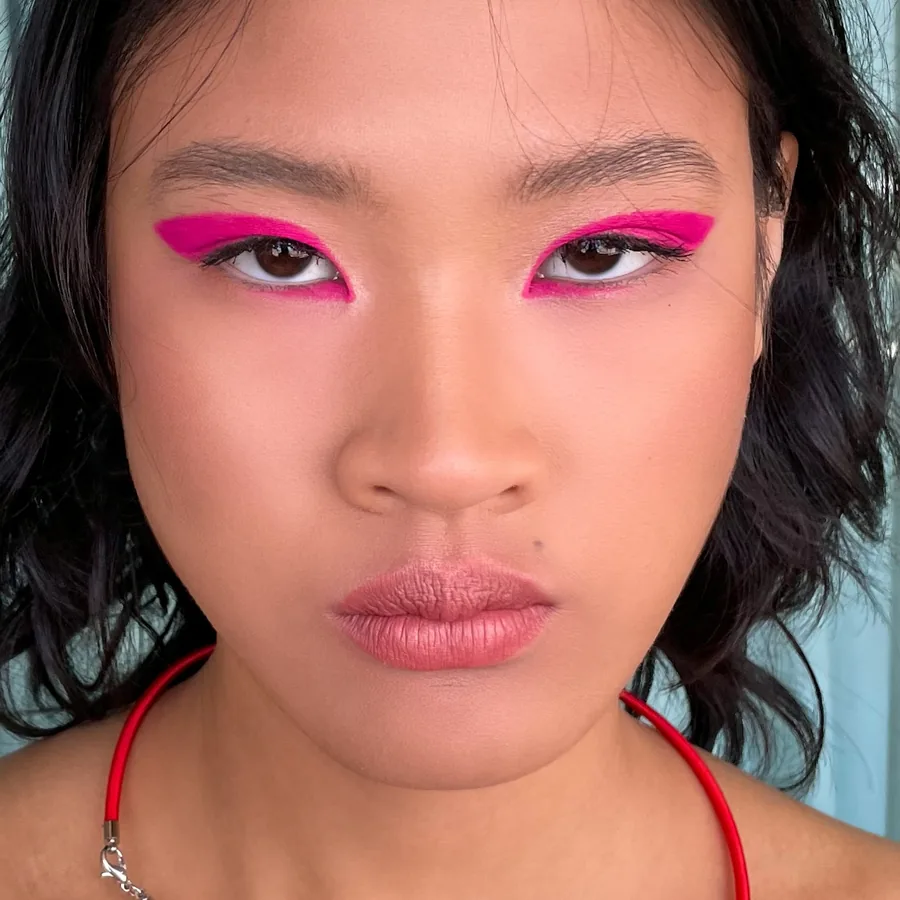 Graphic hot pink liner, creative makeup by an Asian makeup artist in Melbourne