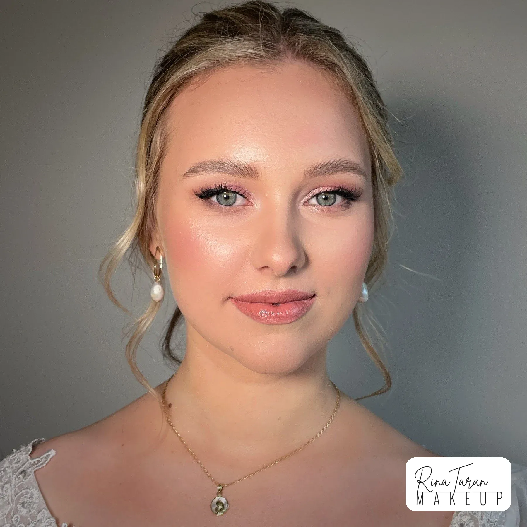 Close-up of natural bridal makeup: glowing skin, soft brows and a nude lip