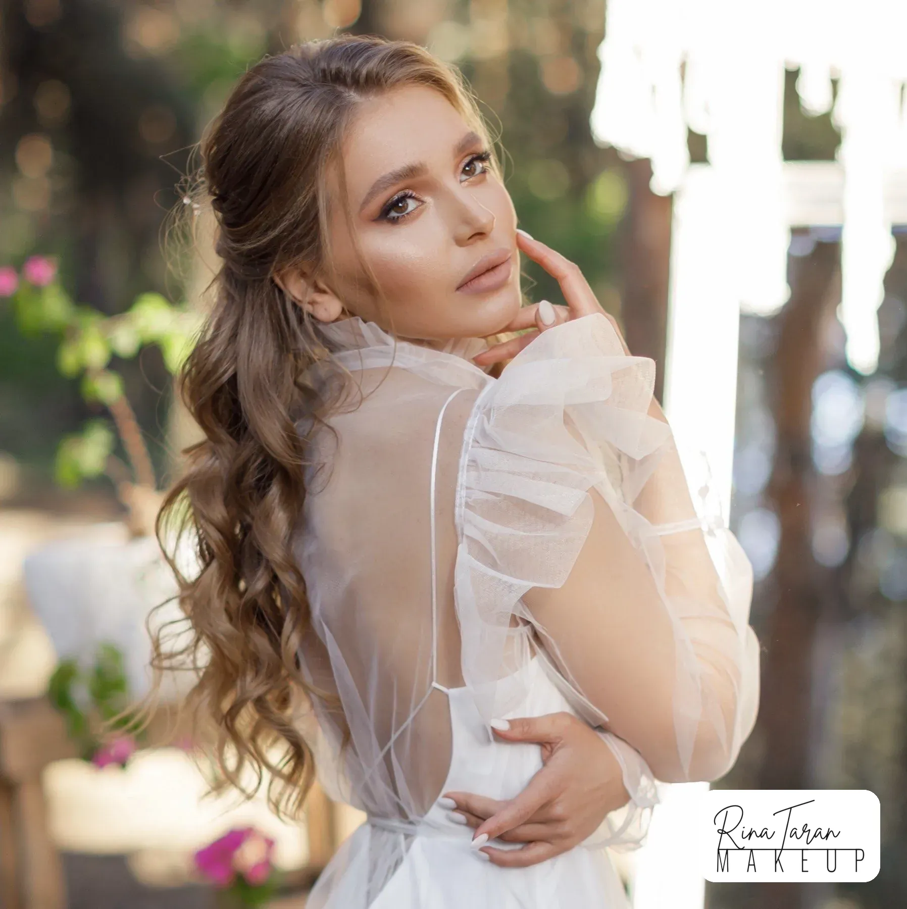 Bridal makeup with a warm bronze eye and a soft nude lip, photographed before the ceremony