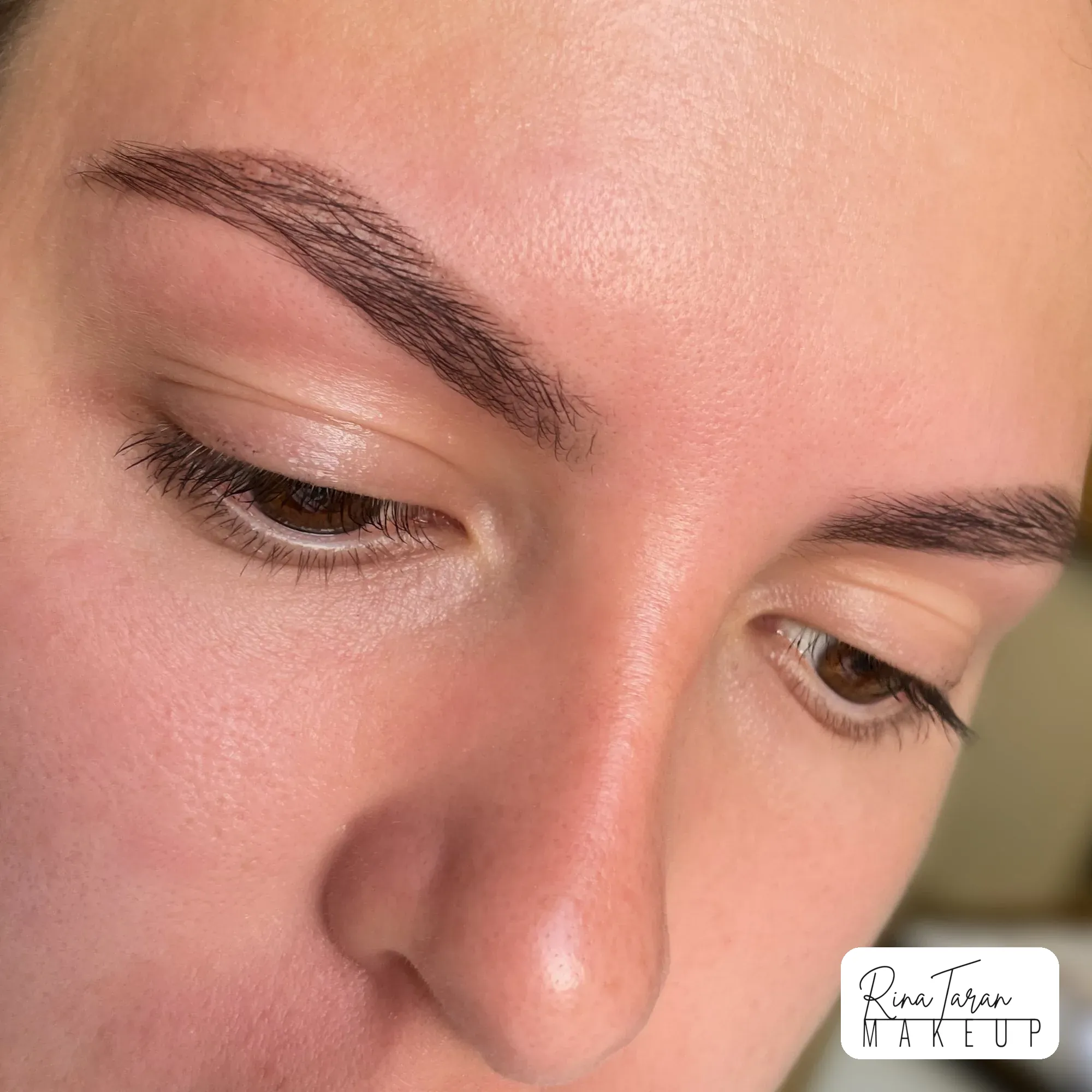 Warm brown brow tint on fair skin, brow shape kept full rather than thin