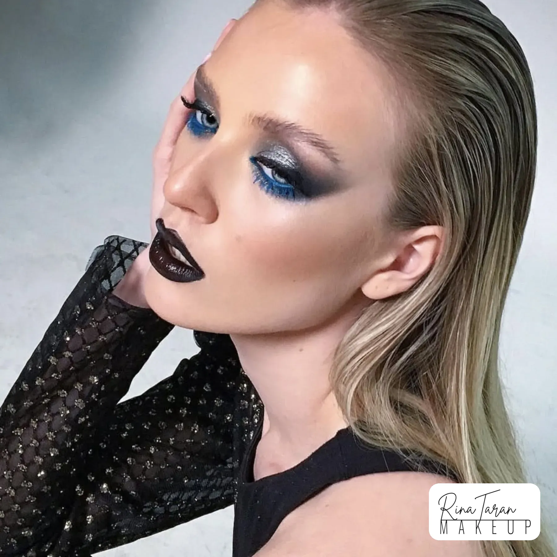 High fashion makeup: silver and blue metallic smoky eye with a black lip
