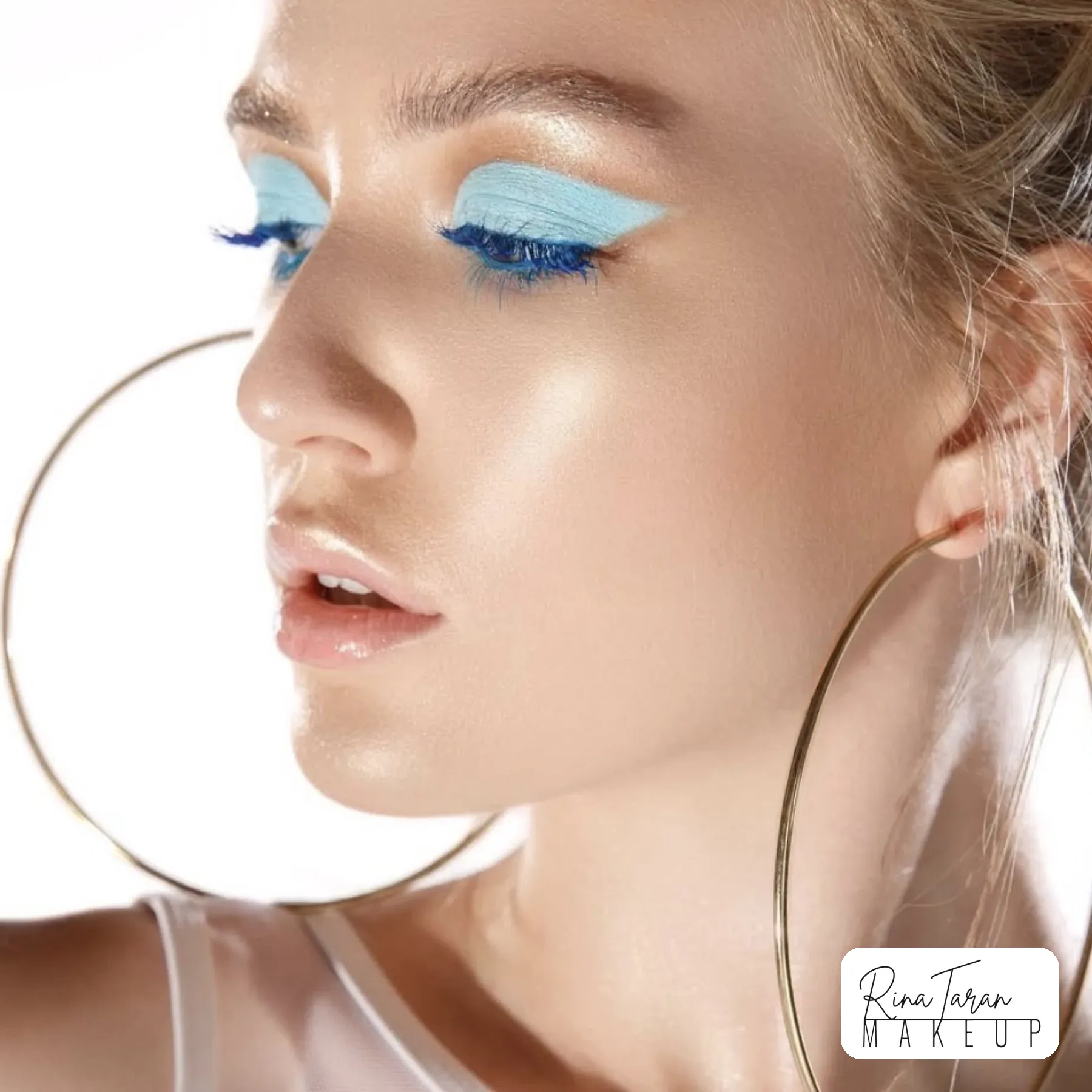 Baby blue graphic lid with blue lashes for a colour beauty editorial