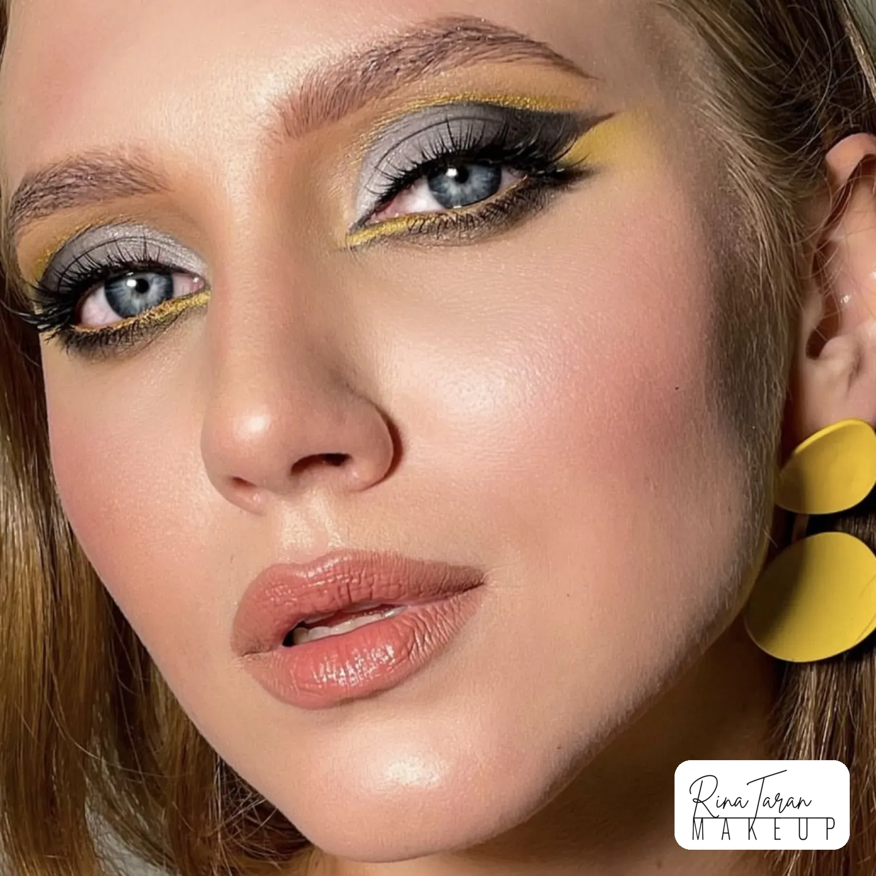 Grey silver lid with a yellow graphic liner, high colour studio editorial