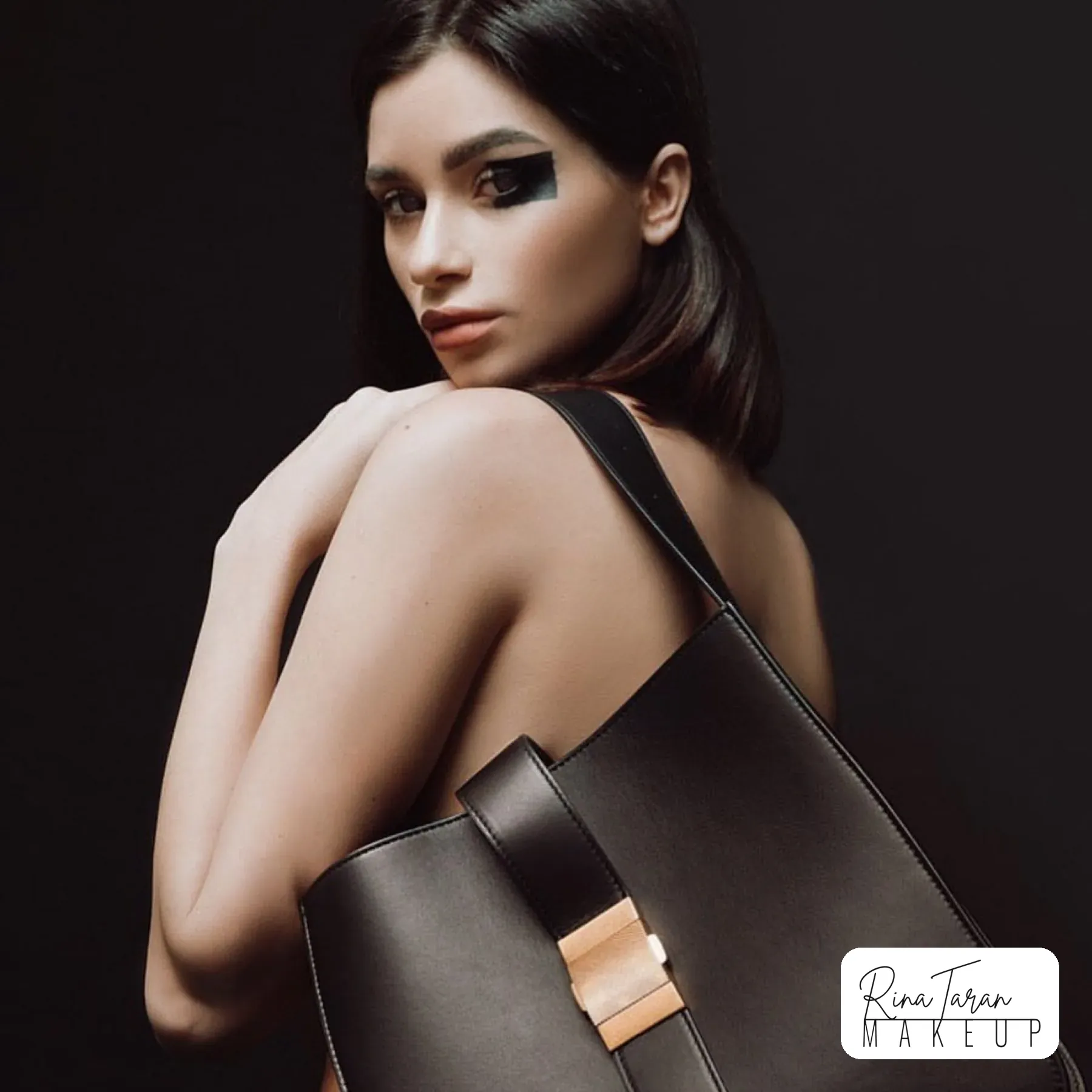 Fashion campaign makeup: a solid black block across the eyes with a nude lip
