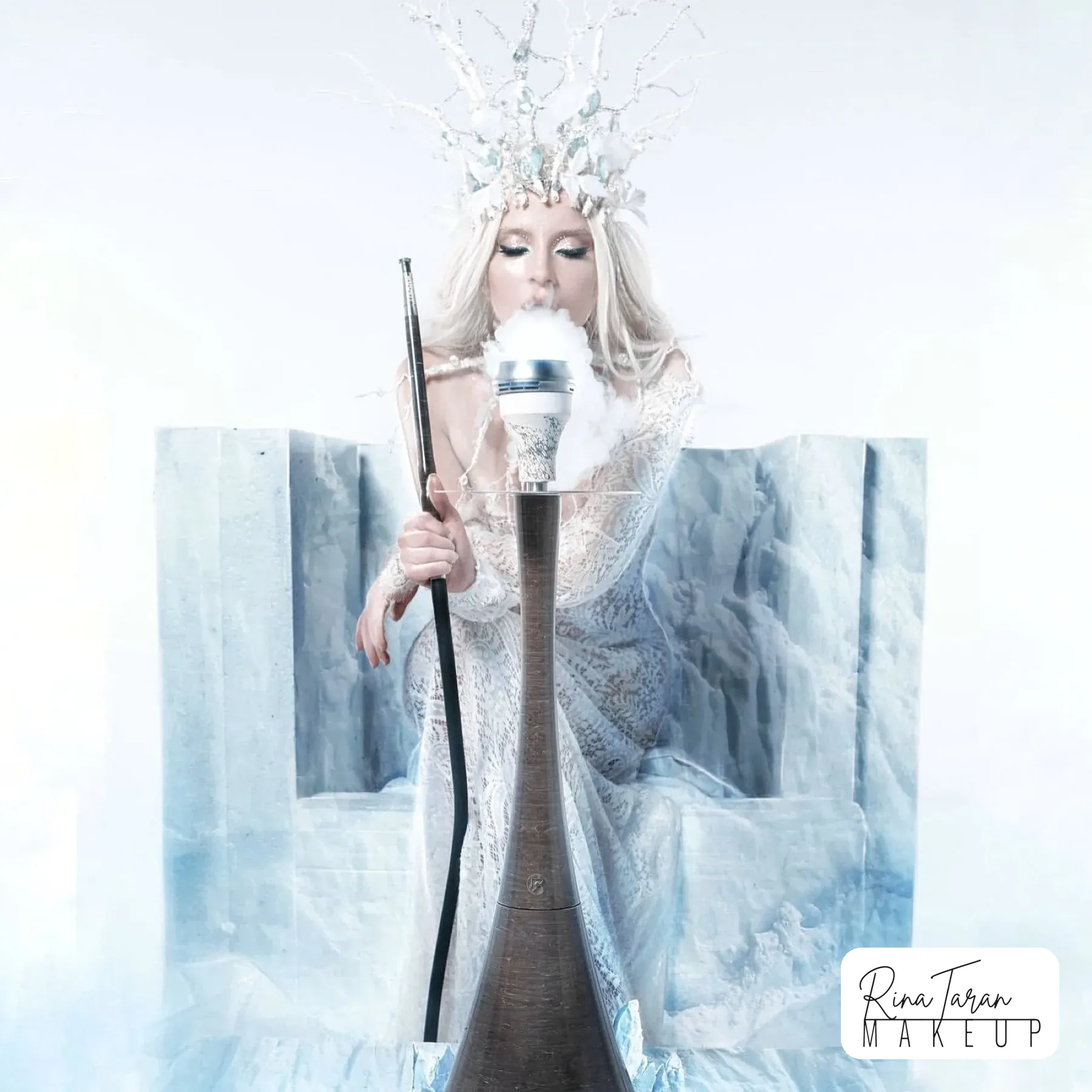 Full length ice queen shoot on an ice throne in white lace and a crystal crown