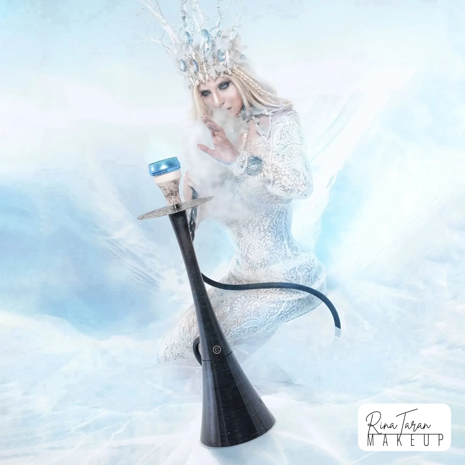 Ice queen studio shoot in white and blue with a branch crown