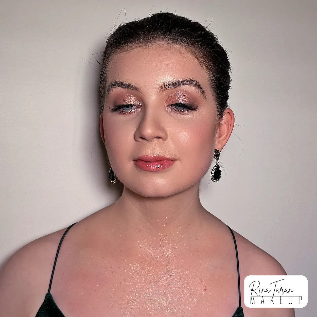 Formal eye makeup close up: soft rose brown shadow, defined lashes and brushed up brows