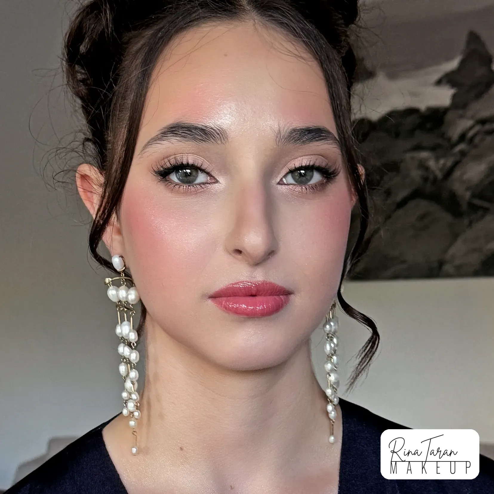 Formal makeup built for photographs: rosy blush, glowing skin and a glossy rose lip