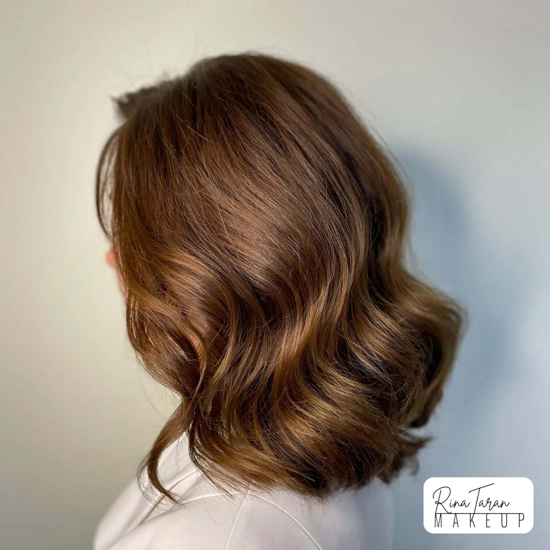 Shoulder-length bob with a soft wave through the ends, styling for shorter hair