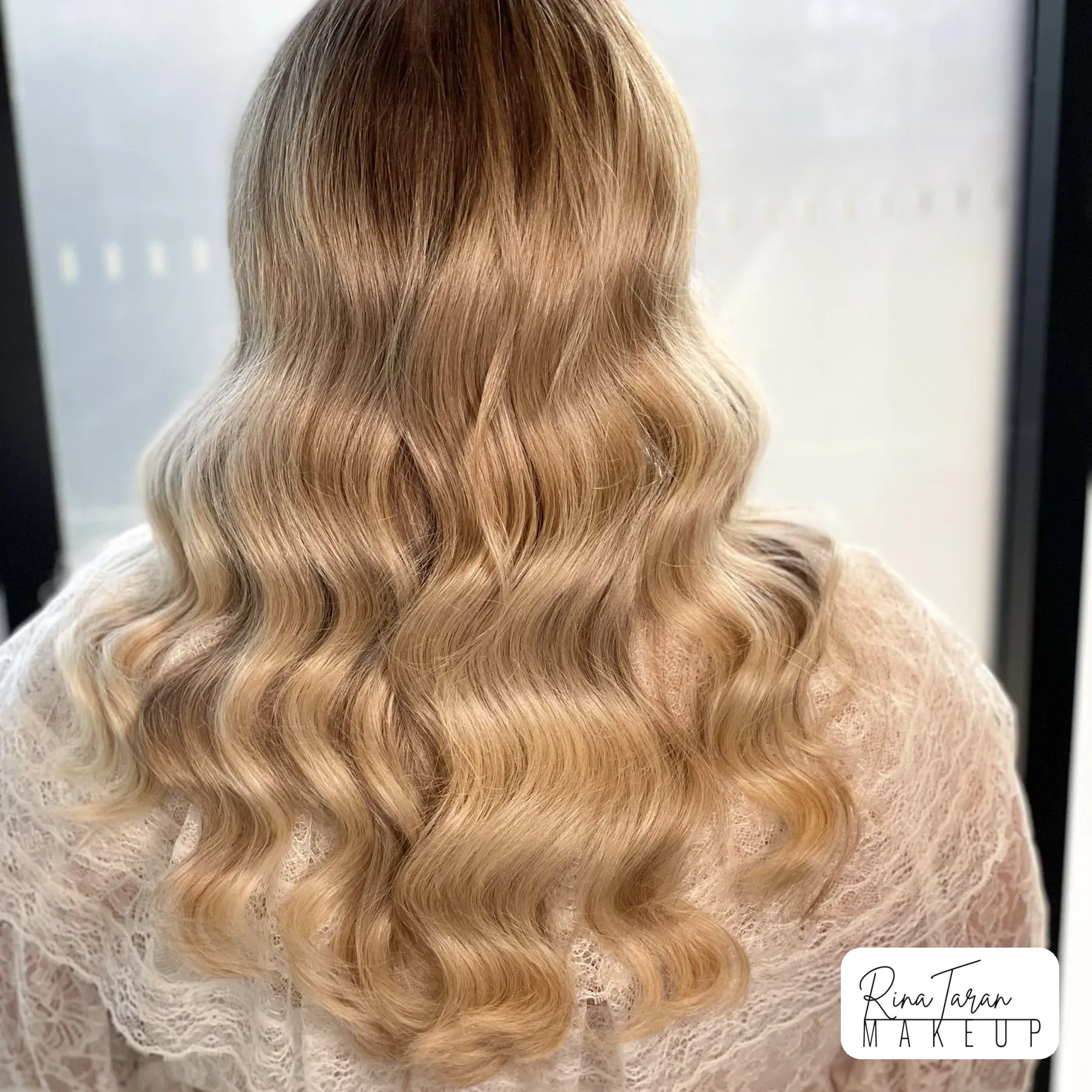 Polished waves seen from the back, evening hair styling that holds all night