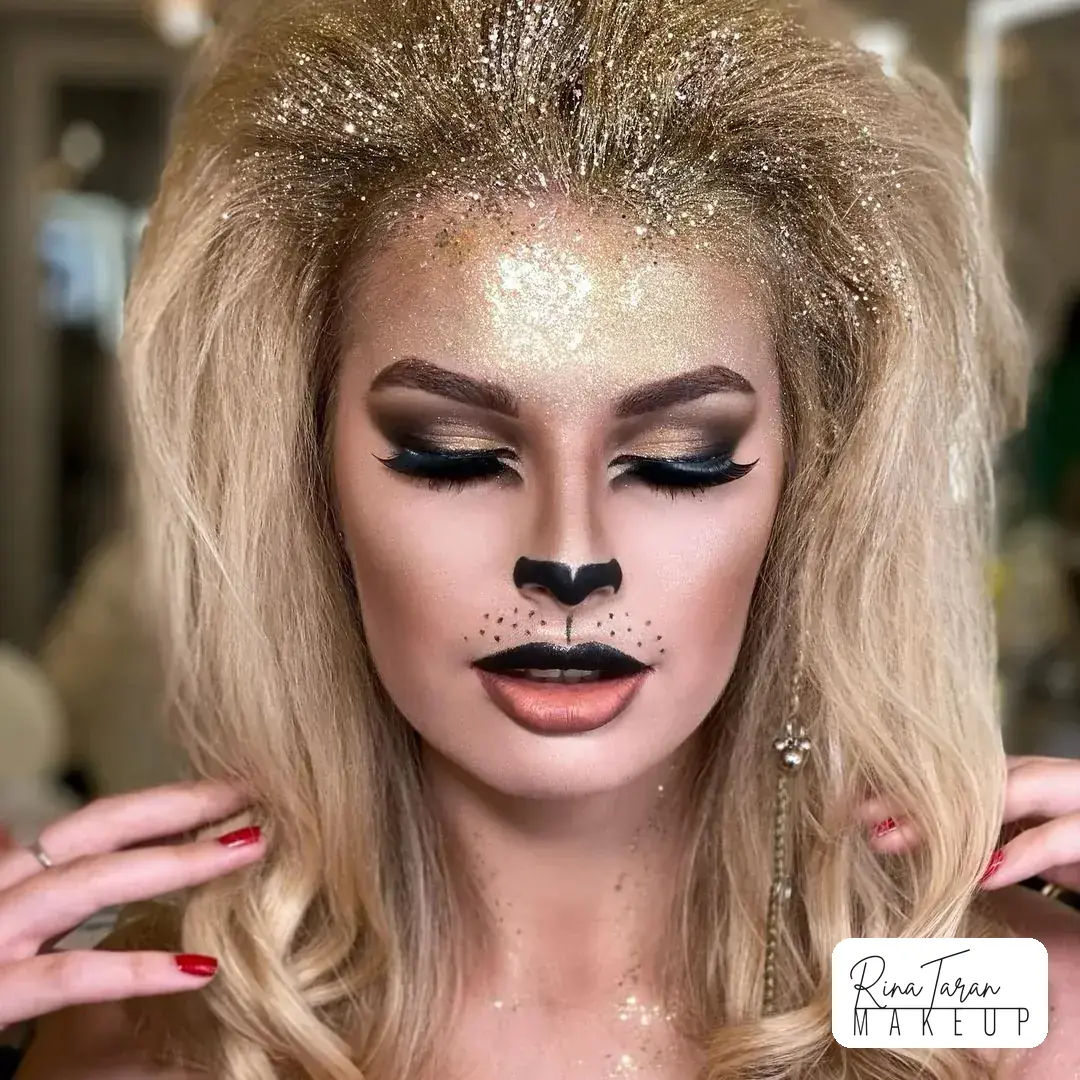 Cat makeup look for Halloween, gold glitter across the lid with a soft painted muzzle