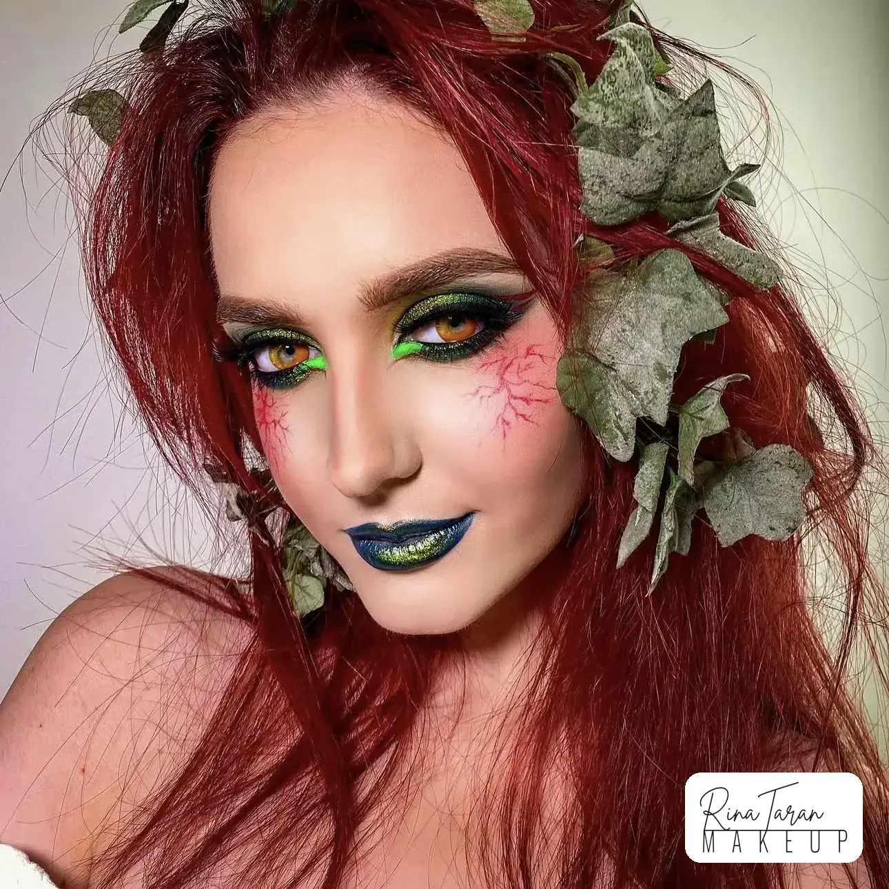 Poison Ivy makeup look with a green and gold eye and a deep green lip