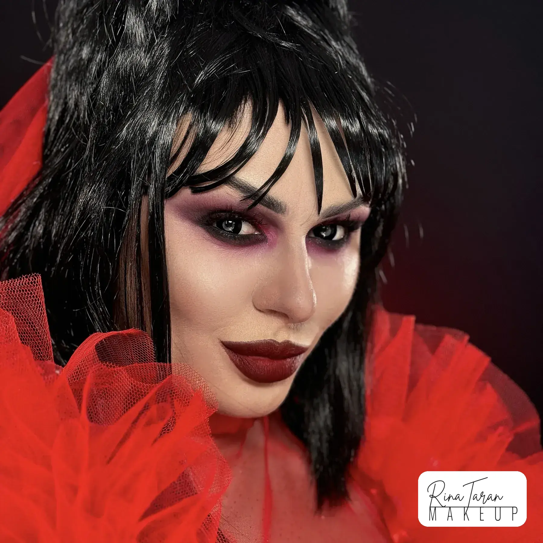 Lydia Deetz makeup look, a plum smoked eye and a dark lip built to hold under red light