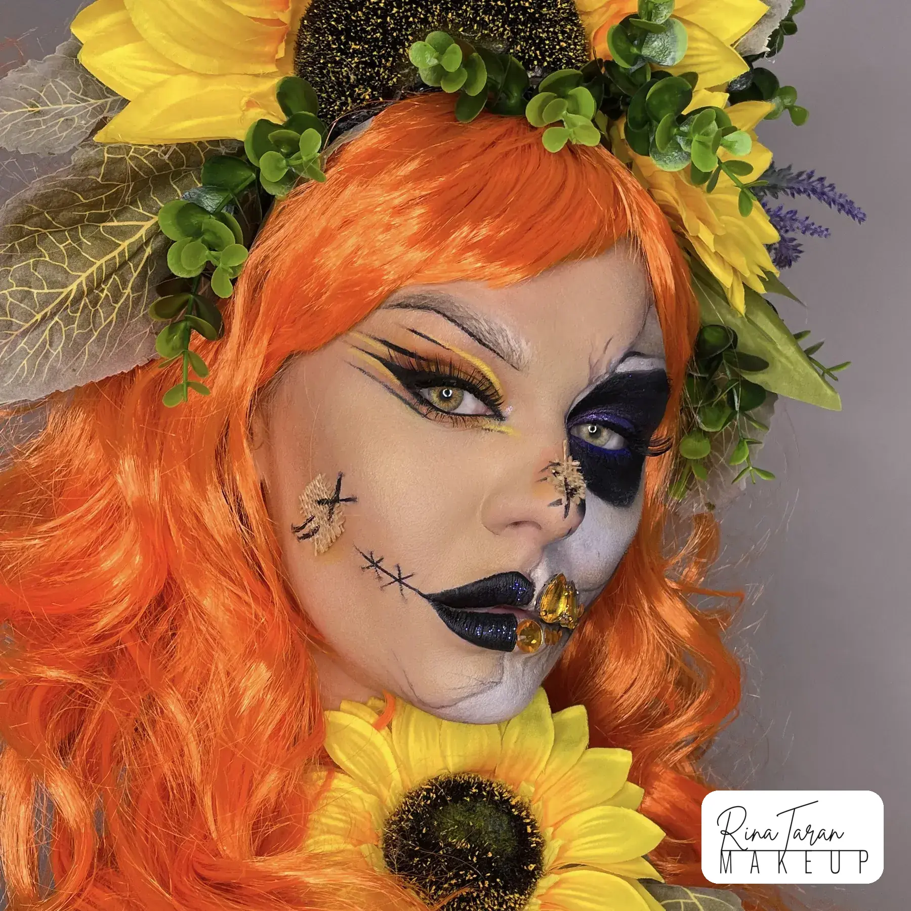 Stitches painted across the lips and one eye socket blacked out, a scarecrow makeup look
