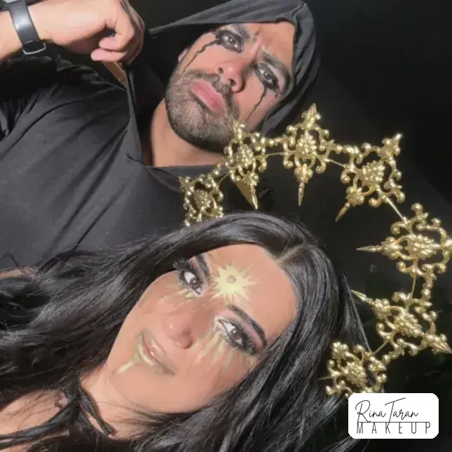 Halloween makeup look for a couple, gold star headpieces worn over smoked eyes