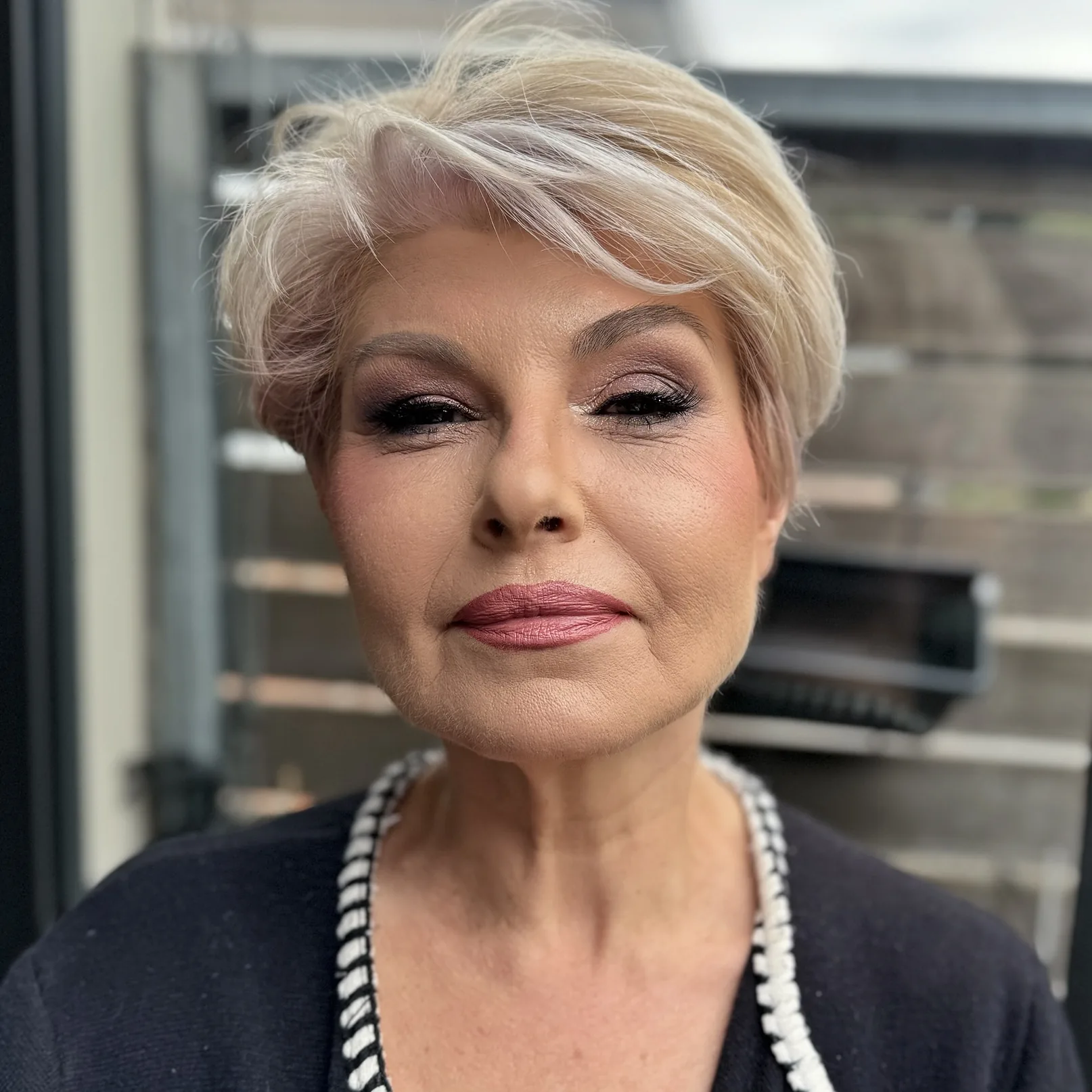 Smudged liner and a mauve lip built to hold through a long evening