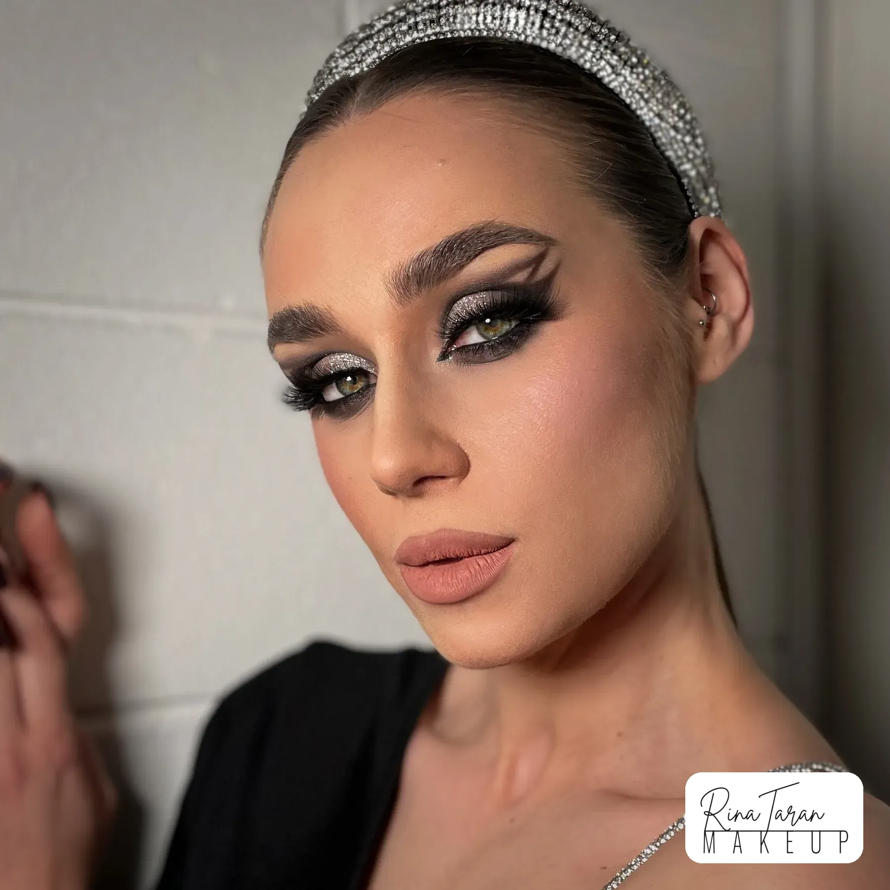 Race day makeup with a crystal headband, smoked grey eye and a soft nude lip