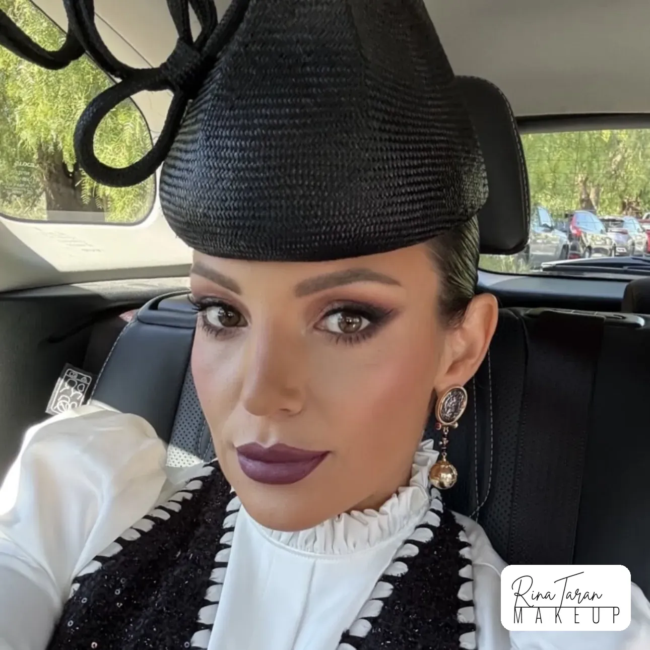 A plum lip with softly smoked lids, a look built to last from the car to the last race