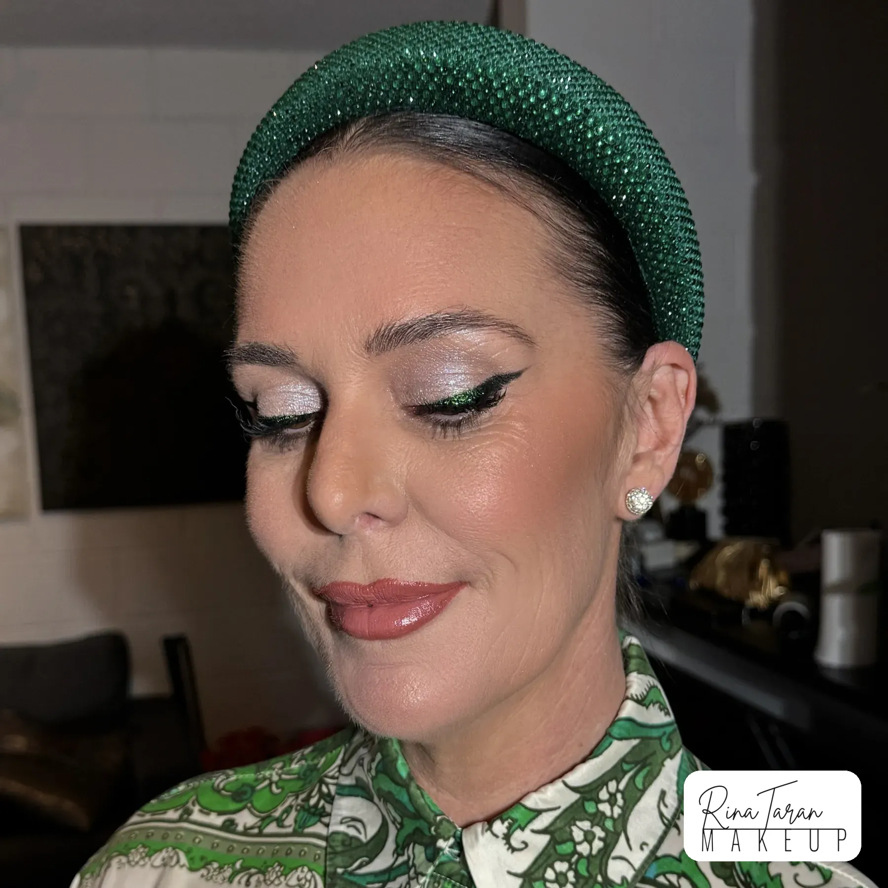 A fine silver liner drawn along the lash line with the lid left clean and luminous