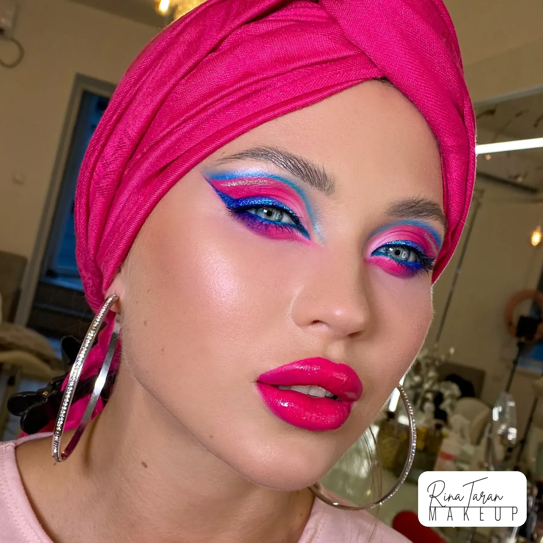 A blue liner cut over pink shadow, drawn to hold its edge through a long day