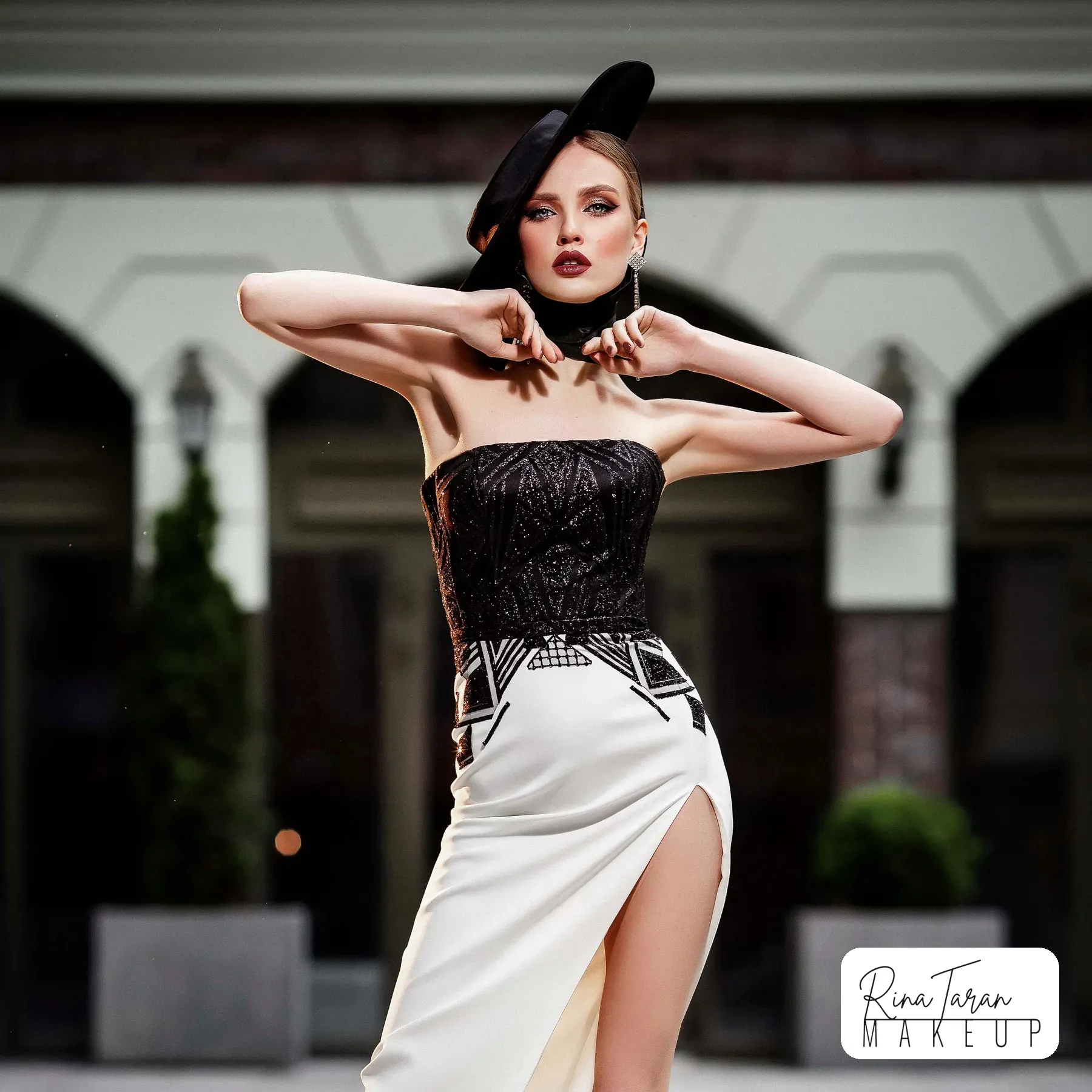 Derby Day styling in black and white, with a deep berry lip seen at full length