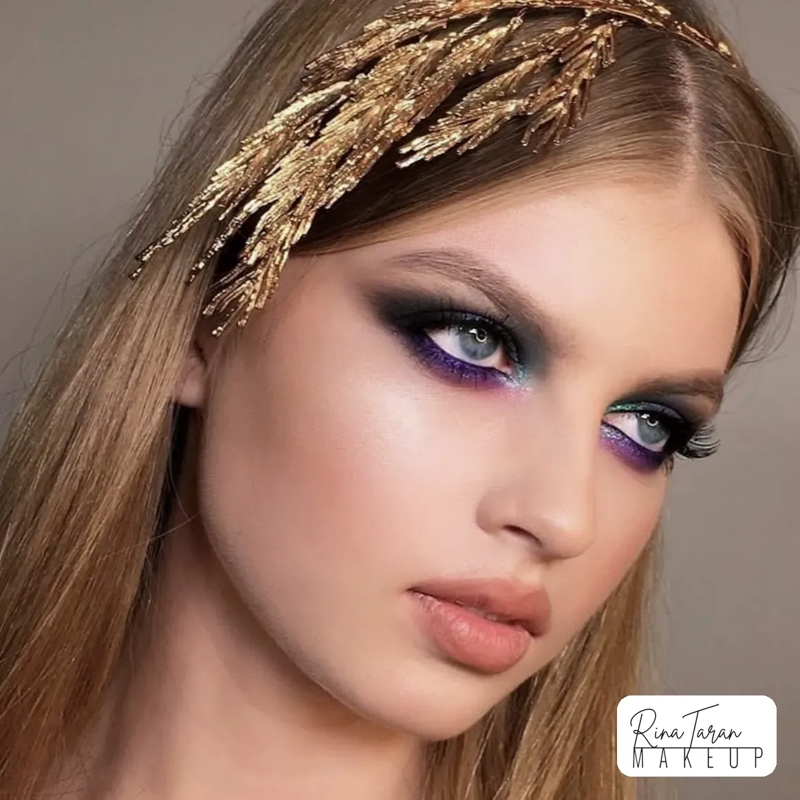 Carnival makeup under a gilded headpiece, violet and teal glitter on a smoked lid