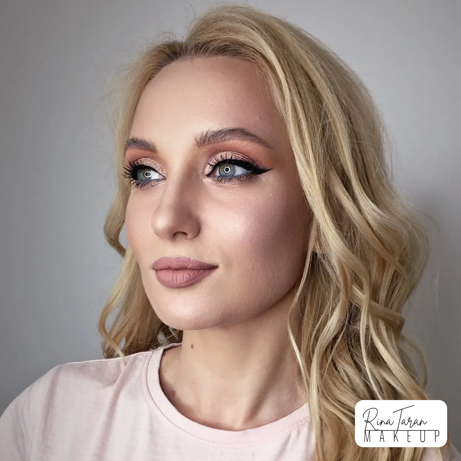 Soft pink smoky eye with a graphic black wing for an evening out