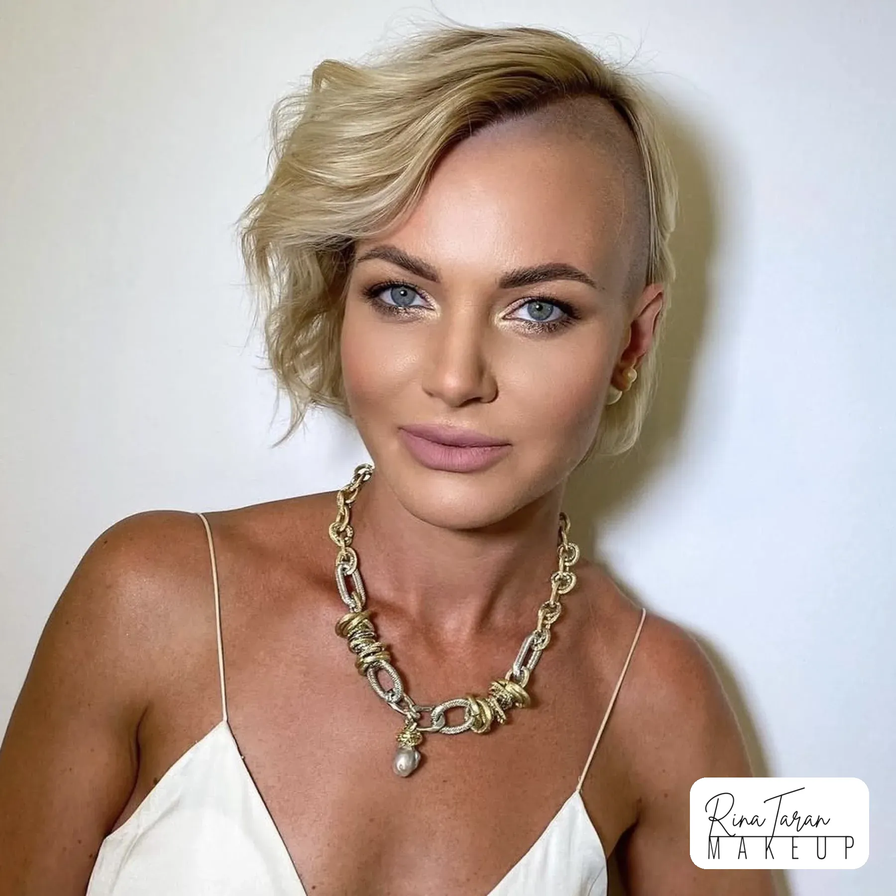 Everyday makeup with a mauve lip on a short blonde bob