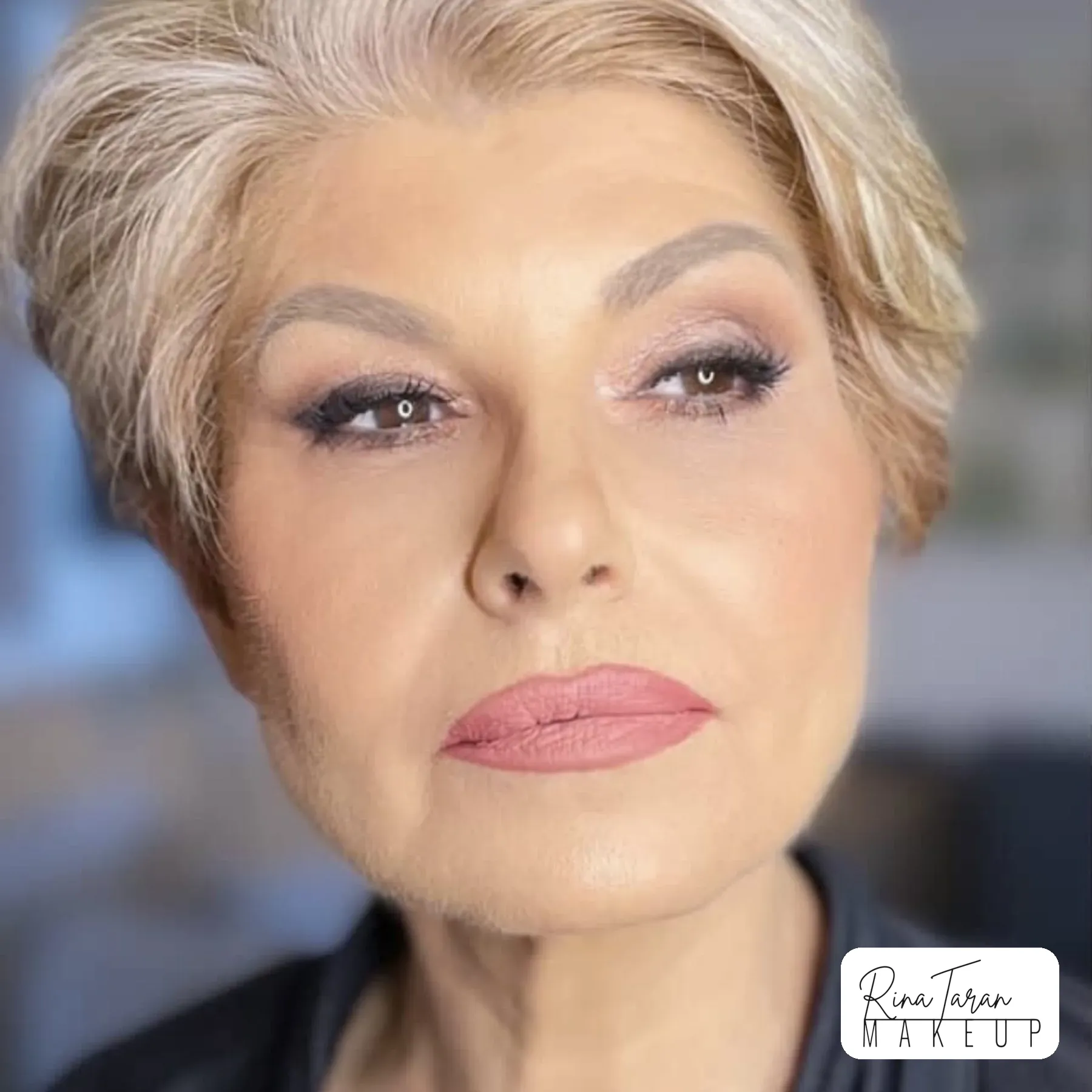 Makeup on mature skin: soft mauve lid, defined lashes and a coral pink lip on a silver pixie
