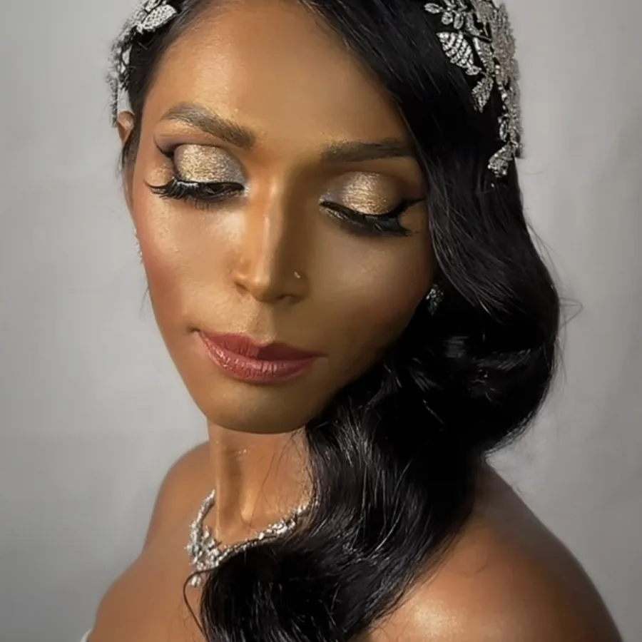 Shimmer gold eye makeup for a South Asian wedding look, eyes closed