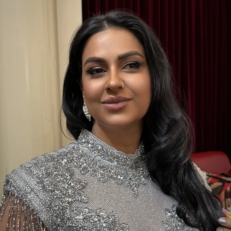 Indian engagement makeup built for long wear, silver beaded gown