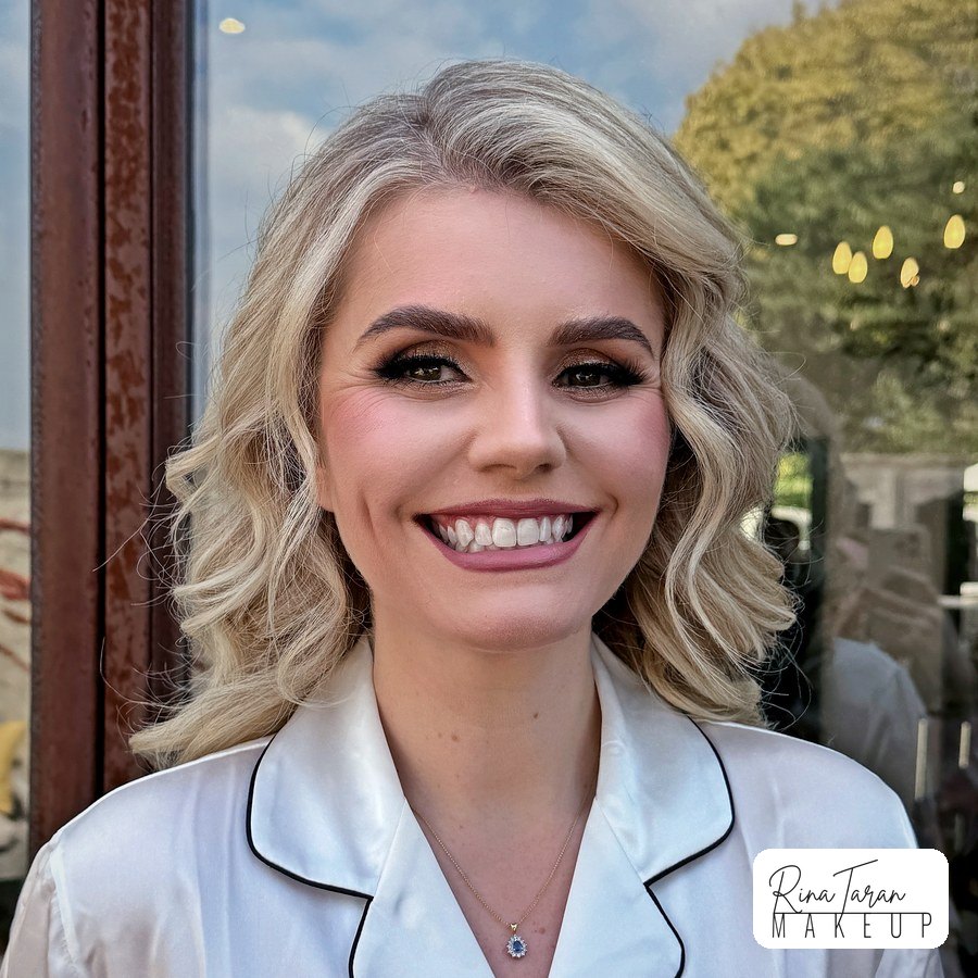 Bridal makeup with a gold smoky eye and winged liner, before the dress at a Yarra Valley wedding