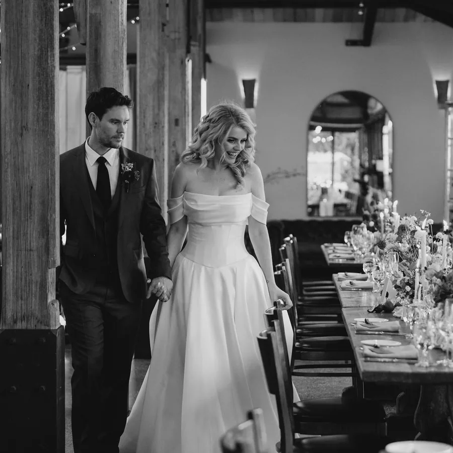 Bride and groom in the barn at Stones of the Yarra Valley, hair and makeup still fresh at dinner